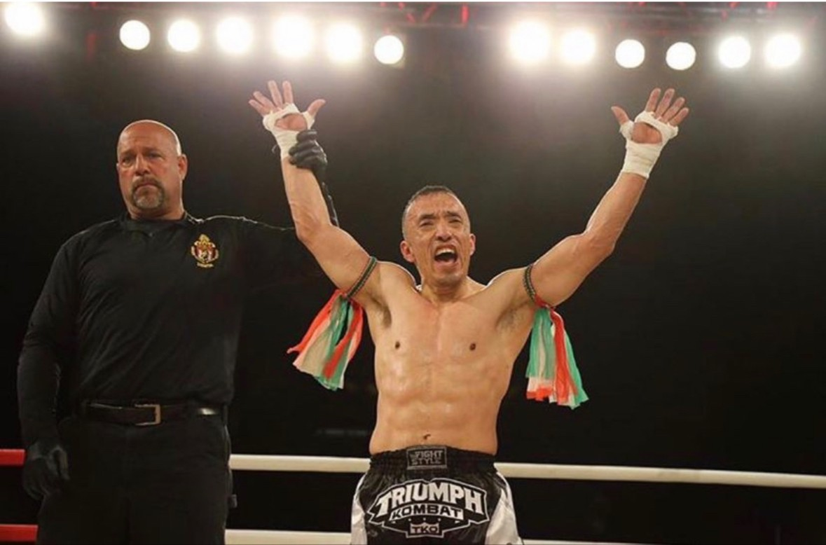 Head Coach Ricky Mora celebrating a win in the ring